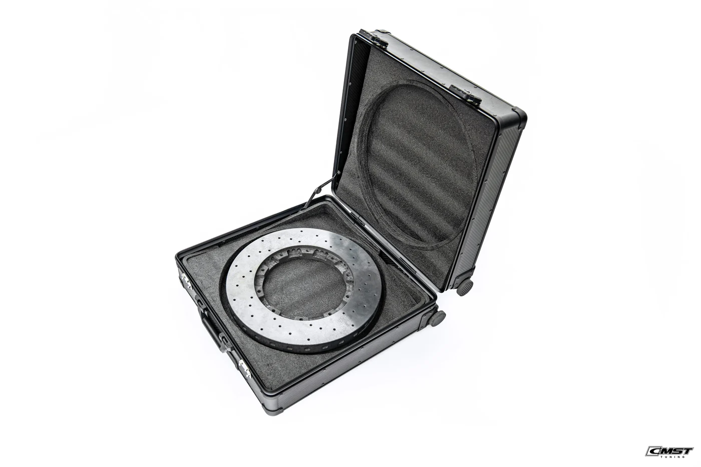 A CMST carbon ceramic brake disc in a fitted CMST hard case