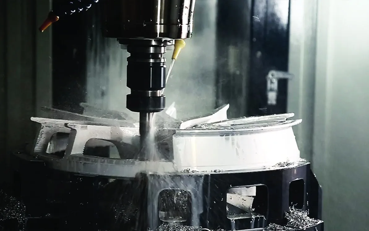 A CMST wheel face being CNC machined under coolant